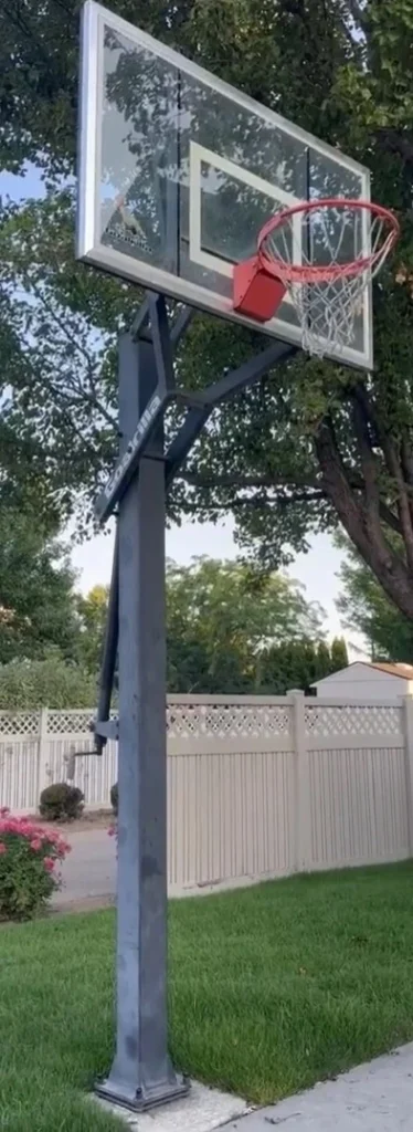 Goalrilla GS54 compact 54-inch in-ground basketball hoop review showing stable anchor system and professional-grade tempered glass.